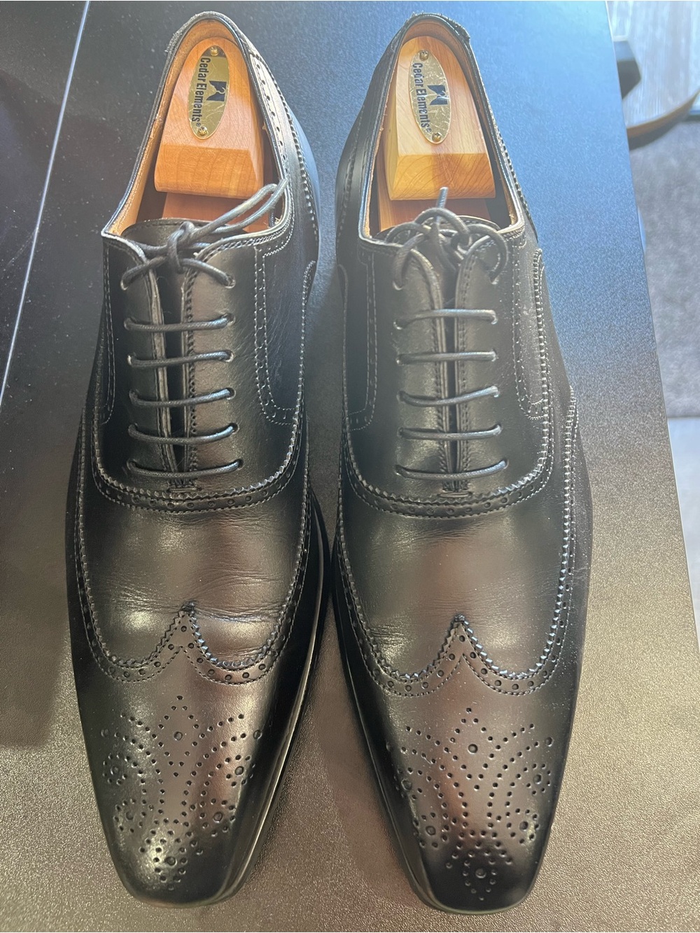 Magnanni Black Leather Wingtip Oxfords with Brogue Perforations